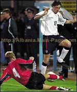 Arian Xhumba slides in to tackle Steve McManaman