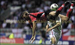 Xhumba leaps over Owen's head